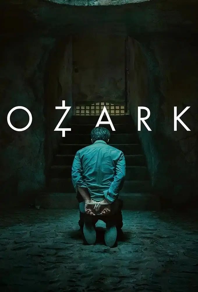 Ozark Netflix series poster featuring Jason Bateman as Marty Byrde standing by a lake with dark, moody lighting reflecting the crime drama theme